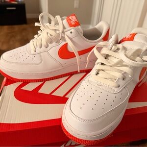 Nike White Low-Top Sneakers with Bright Orange Swoosh
